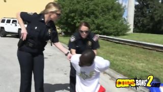 Black guy on an ATV at the hood gets arrested by two horny cops that decide to fuck him hard.